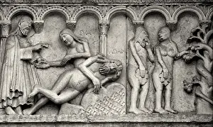 Italien Prints: Carving of the Fall of Adam and Eve on the facade of the Cathedral of San Geminiano in Modena
