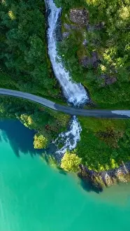 Norwegian Sky Prints: A cascading waterfall empties into a stunning turquoise fjord in Norway