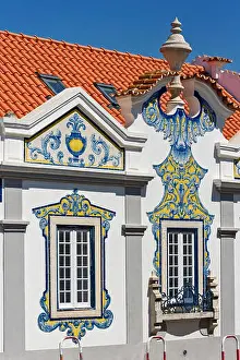 Pediment Prints: Cascais, Portugal, ancient aristocratic villa with facades decorated with yellow and blue azulejos