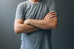 Comforting Prints: Casual adult man with arms crossed