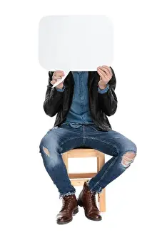 Full Body Prints: casual man with black leather jacket is sitting on a wooden chair with face covered by a speech bubble on white studio