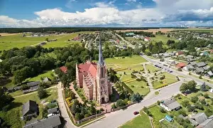 Catholic historical cathedral in small town aerial drone view