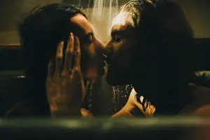 Young Couple Prints: Caucasian couple relaxing in bathtub under shower