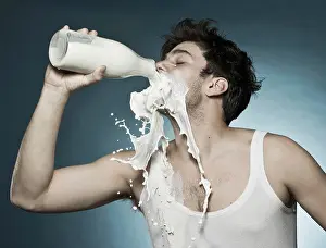 Thirst Prints: Caucasian man drinking milk and spilling it