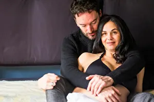 Relation Prints: caucasian man and pregnant woman rest on the bed in the wake up morning time scene