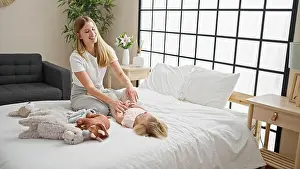 Awake Prints: Caucasian mother and daughter tickle-fest! a heartwarming scene of laughter in the bedroom