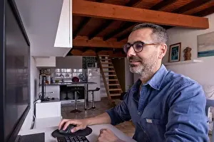 One Man Only Prints: Caucasian spanish man portrait working on computer happy