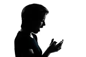 Phone Call Prints: one caucasian young teenager silhouette girl telephone videophone video game portrait in studio cut out isolated