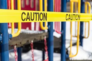 Corona Virus Prints: Caution tape around closed down playground during coronavirus COVID-19 pandemic