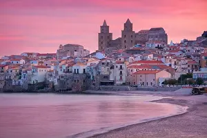 Cefalu, Sicily, Italy. Cityscape image if coastal town Cefalu in Sicily at dramatic sunset