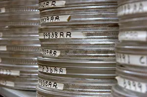 Reel Prints: Celluloid film canisters. Stacked high in archive storage, Close up