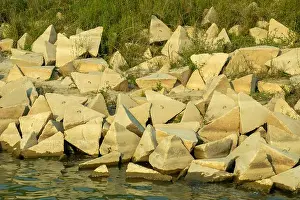 Cement Concrete CC blocks are strategically placed along the riverbank as a vital erosion control measure to protect