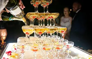 Goggles Prints: Champagne glasses standing in a tower at the wedding party