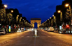 Champs Elysees Prints: The Champs-Elysées and the Arc de Triomphe in Paris during the night