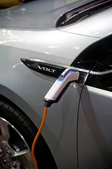 Alternative Energy Prints: Charging cable plugged into a Chevrolet Volt at 'AltCar' show exhibition in Santa Monica