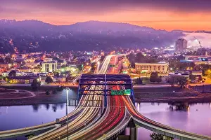 Charleston, West Virginia, USA downtown skyline over the interstate and the river