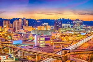 Charleston, West Virginia, USA downtown skyline over the interstate and the river