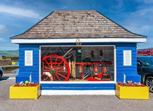 Firefighter Prints: Charming blue structure showcasing vintage maritime memorabilia