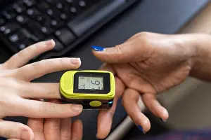 Medical Equipment Prints: Checking blood oxygen saturation with a pulse oximeter