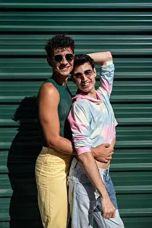 Supportive Prints: A cheerful gay couple sharing an affectionate hug