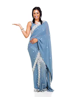Saree Prints: cheerful Indian woman wearing sari presenting isolated on white
