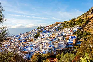 Berber Prints: Chefchaouen, blue city skyline on the hill, Morocco