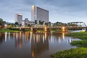 Chiang Mai, Thailand hotel skyline on the Ping River at dusk