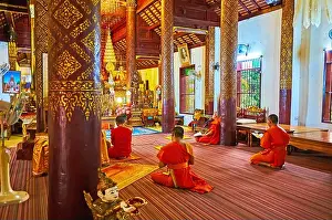 Chiang Mai Prints: CHIANG MAI, THAILAND - MAY 3, 2019: Bhikkhu monks pray in Viharn of Wat Ket Karam