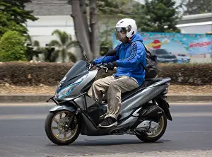 Chiangmai Prints: Chiangmai, Thailand - April 14 2020: Man and Private Honda Motorcycle