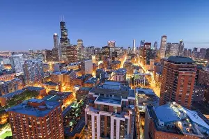 Chicago, Illinois, USA aerial cityscape towards Lake Michigan at dusk