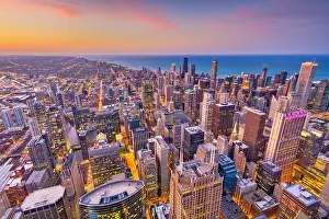 Chicago, Illinois, USA aerial downtown skyline at dusk towards Lake Michigan
