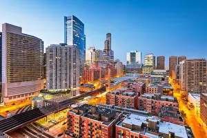 Chicago, Illinois, USA downtown cityscape and tracks at dusk