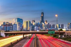 Chicago, Illinois, USA downtown skyline over highways at twilight