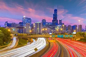 Chicago, Illinois, USA downtown skyline over highways at twilight