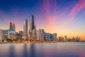 Chicago, Illinois, USA downtown skyline from Lake Michigan at dusk