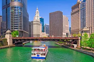 Chicago, Illinois, USA sightseeing cruise and skyline on the river