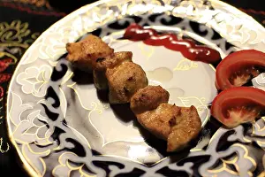 Roast Prints: Chiken kebab on a plate in the uzbek restaurant