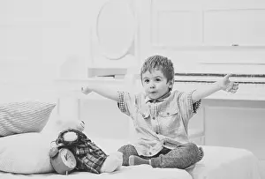 Teddy Prints: Child in bedroom telling fairytale for toy