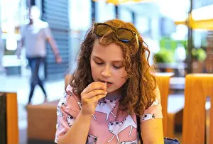 Ketchup Prints: Child girl enjoying french fries