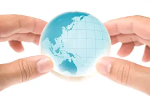 Continents Prints: Child holding a globe in hands