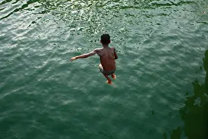 Dhaka Prints: Children are enjoying the Hatirjheel Lake during the hot summer weather in Dhaka