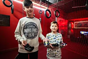 Brothers Prints: Children flying remote control drones game indoor play zone