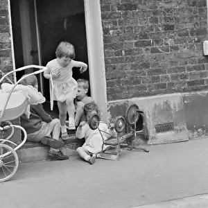 English Heritage Prints: Children playing on a doorstep, London, 1960-1965. Artist: John Gay