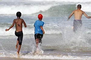 Eastern Cape Prints: CHILDREN RUN INTO INDIAN OCEAN JEFFREY'S BAY EASTERN CAPE SOUTH AFRICA 26 January 2011