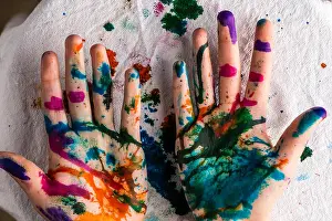 High Resolution Prints: A child's hands are covered in red