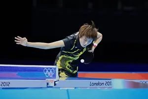 Olympic Games Prints: Chinas Ding Ning competes against Kasumi Ishikawa of Japan in the final of the womens team table tennis during