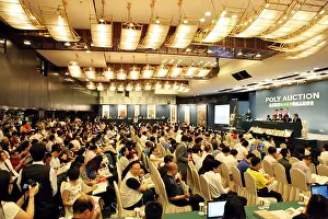 Poly Prints: A Chinese auctioneer runs the bidding for a painting by Chinese artist Zhang Daqian during the 2010 Poly Spring