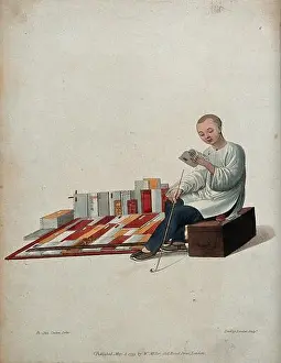 Merchant Prints: A Chinese bookseller seated on a box in the street