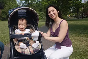 Throwing Prints: Chinese mother and baby in stroller at park