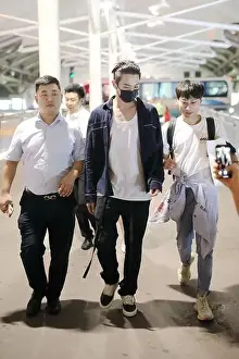 Chinese singer and actor Xukai arrives at the Beijing Capital International Airport after landing in Beijing